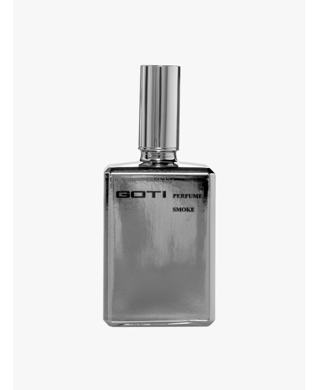 Front of the silver-tone glass bottle of Goti Smoke perfume.