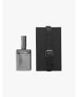 Front view of the silver-tone glass bottle of Goti Black perfume and black box with strap.