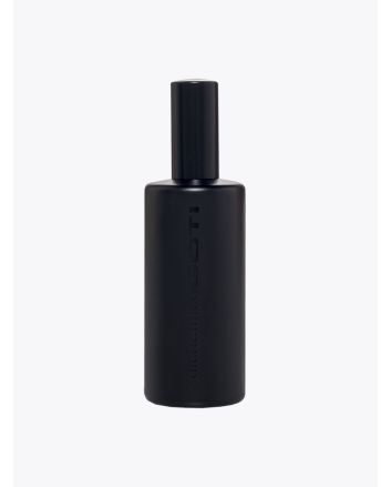 Front view of the black glass bottle of Goti Alchemico Acqua parfum.