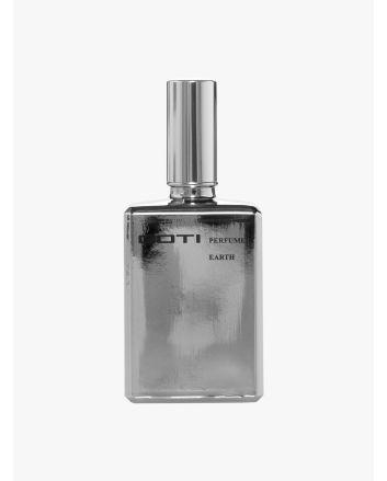 Front of the silver-tone glass bottle of Goti Earth perfume.