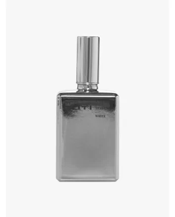 Front view of the silver-tone glass bottle of Goti White perfume.