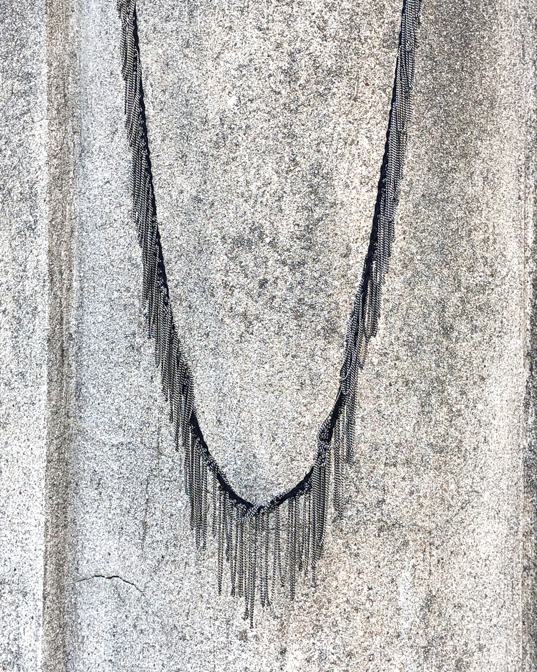 Fron view of Goti Necklace Model CN1171 made with silver chain and black cotton ribbon